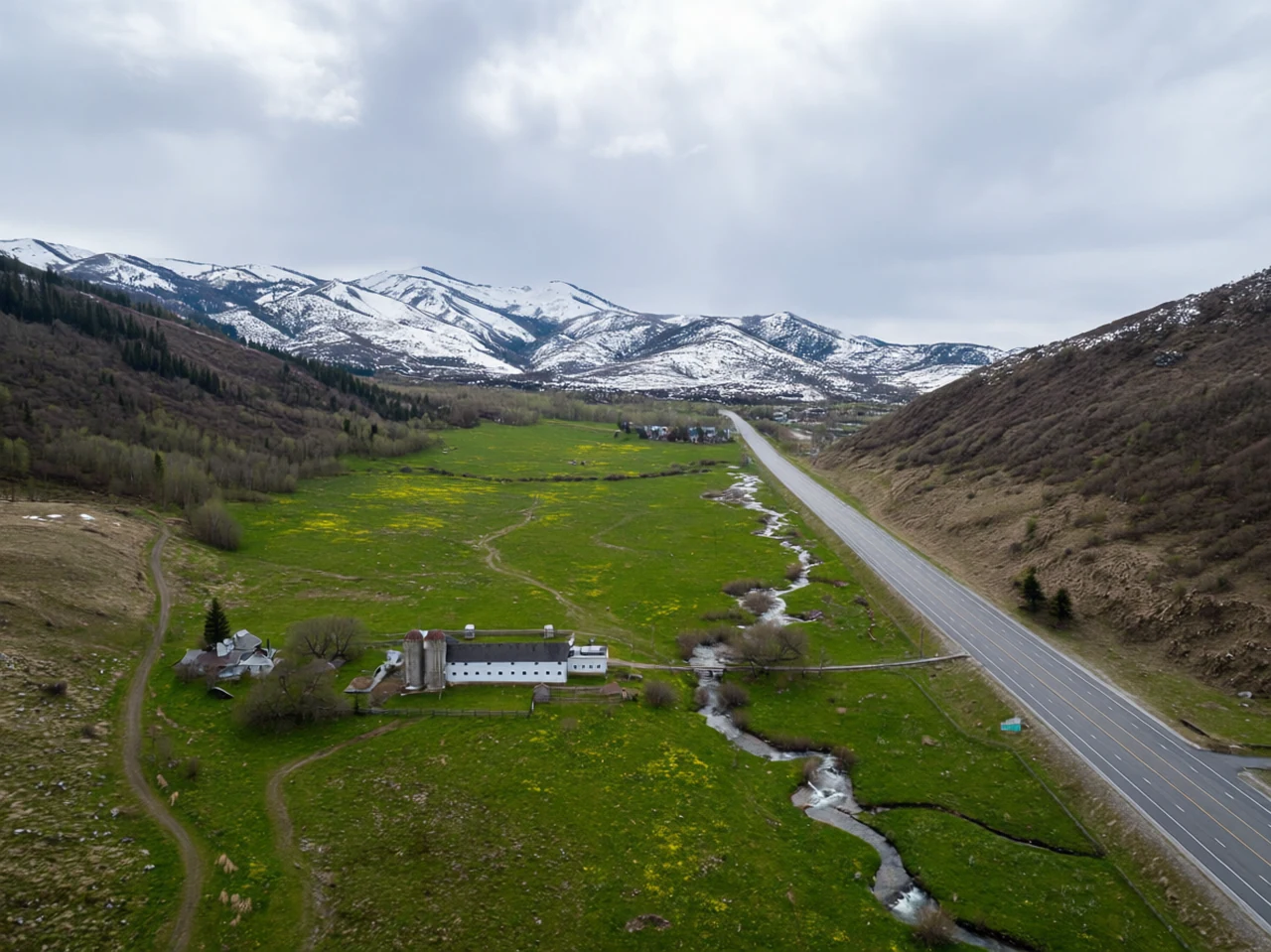 Mountain valley spring thaw at Snowy Utah mountain corridor, generated by our world model